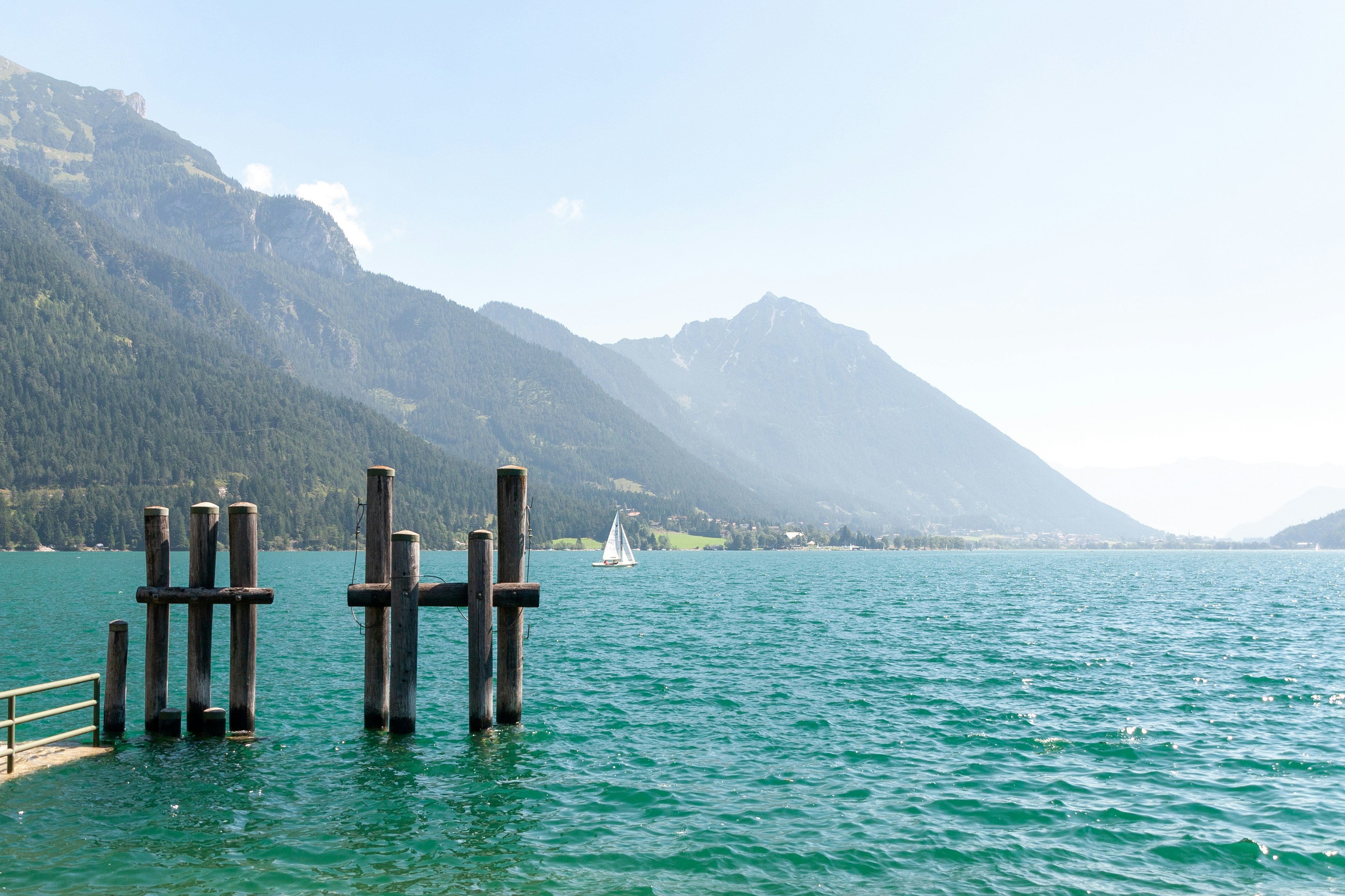 brown wooden dock on body of water during daytime